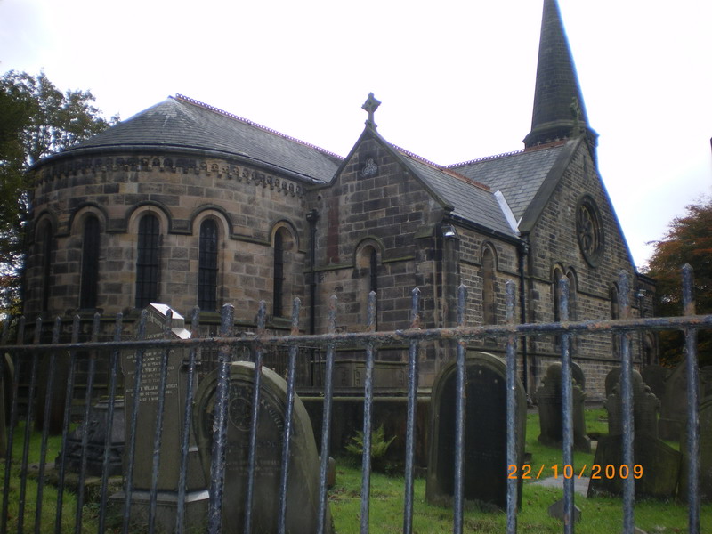 Grave seen through railings from outside