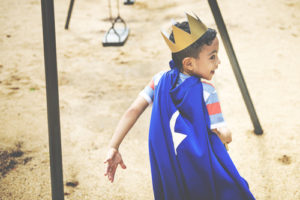 Kid in Superhero cape