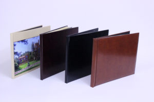 four photo books lined up with different style covers